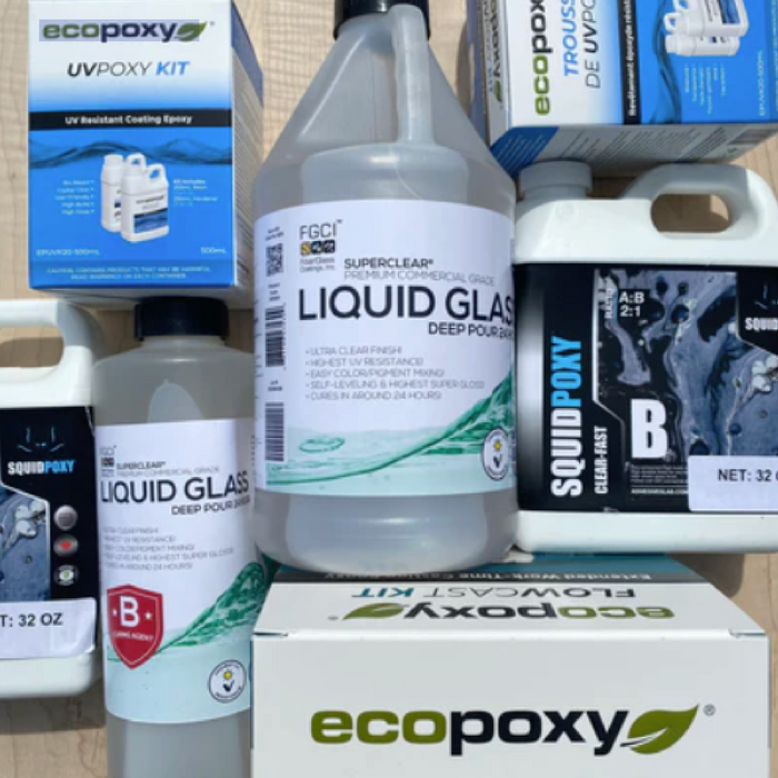 epoxy and resin brands all laid out for customers to see ecopoxy, liquid glass, super clear, squid poxy, flow cast, uv resin. All these resins are reputable brands that customers should consider when making DIY woodworking resin and epoxy projects
