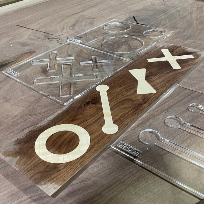wooden bow tie inlay with clear acrylic router templates.