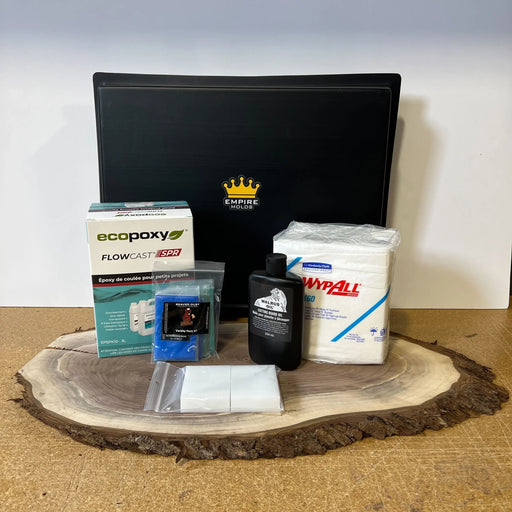 kit showing all the products you get with your purchase. Walrus cutting board oil Ecopoxy resin wypall pads for finishing and white HDPE blocks. Pigments with mica powder and blue colours and an empire black epoxy resin mold