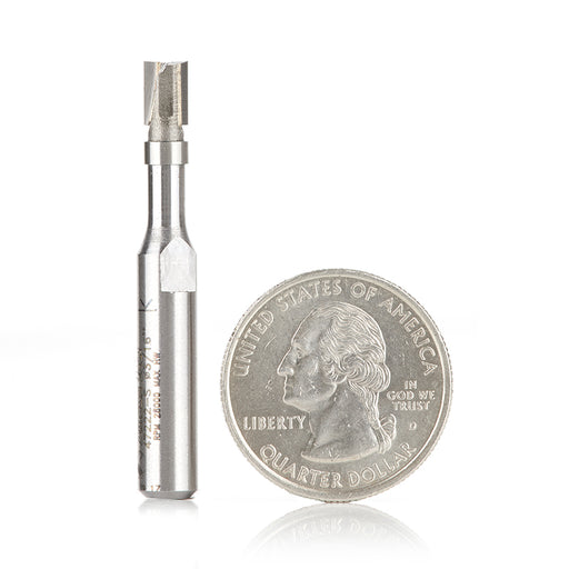 a flush trim bit with an american united states of America quarter to show the customer scale of how small this router bit is