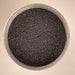 black charcoal looking colour of a fine micro pigment that can be used for Glimmering mica powder for nail art