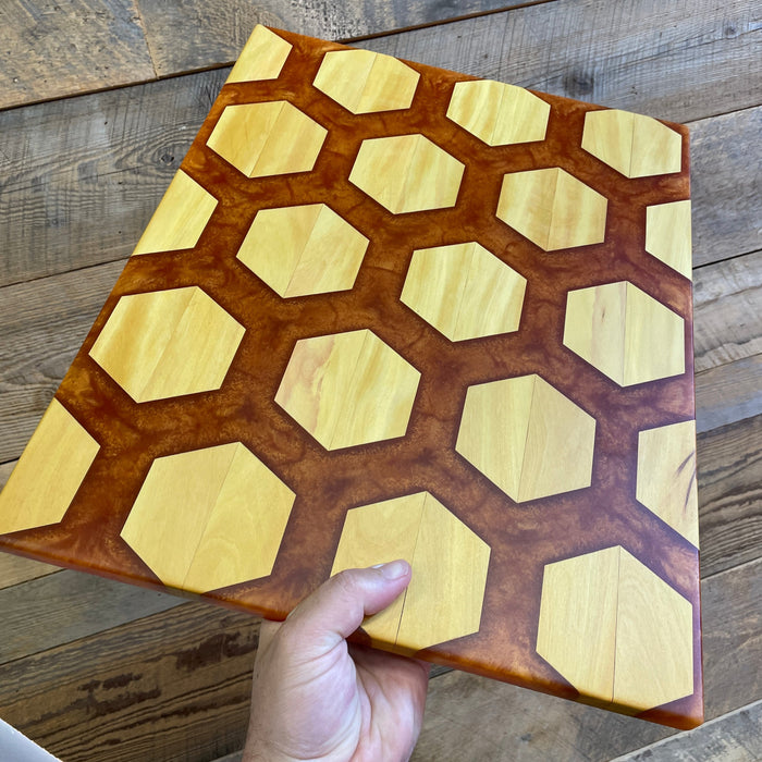 yellow heart hexagon shapes that displays twenty of them slightly separated out and have a deep copper colour flowing between all the shapes