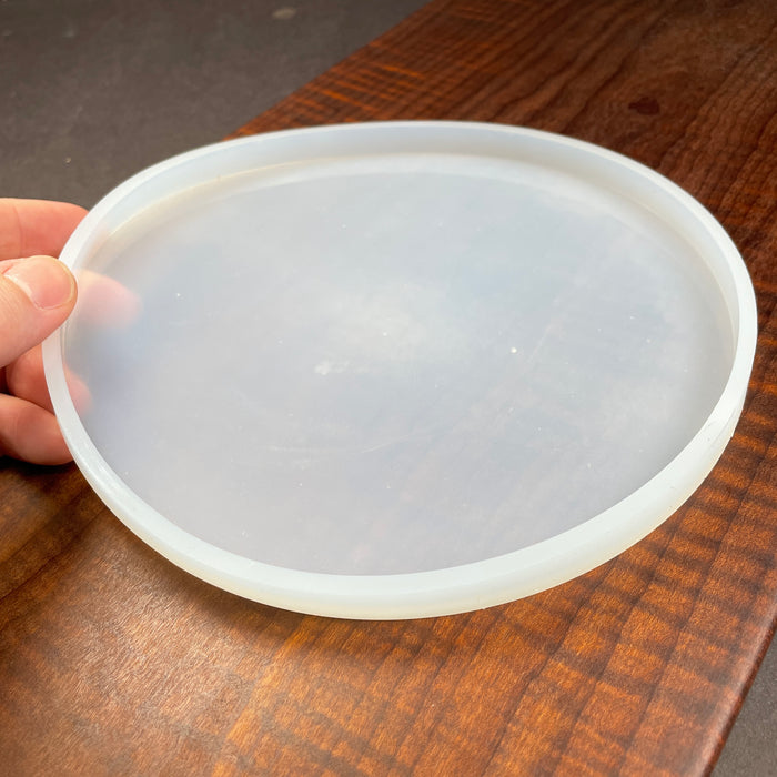 biggest size of circle reusable silicone mold available for coasters or hot pads that can be reused and filled with different liquid materials as they cure up and become solid