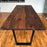 beautiful walnut dimensional table that has black legs attached to the bottom and gives an example of how the pure oil finish highlights all the grain features