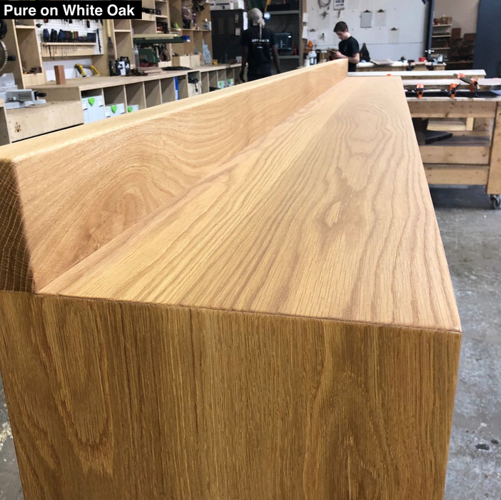 bar top with a mitre joint connecting the top to the bottom gives the customer an example of what white oak and pure oil finish looks like