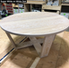 circular white oak coffee table with wooden base shows an example of what white oak oil finish looks like on a wooden top